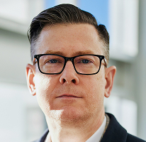 Photo d'Alexander Hughes, directeur général d'une entreprise spécialisée dans le trading de cryptomonnaies
